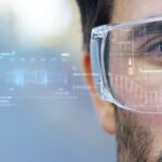 A,Man,Watches,With,A,Futuristic,Look,With,Glasses,Augmented